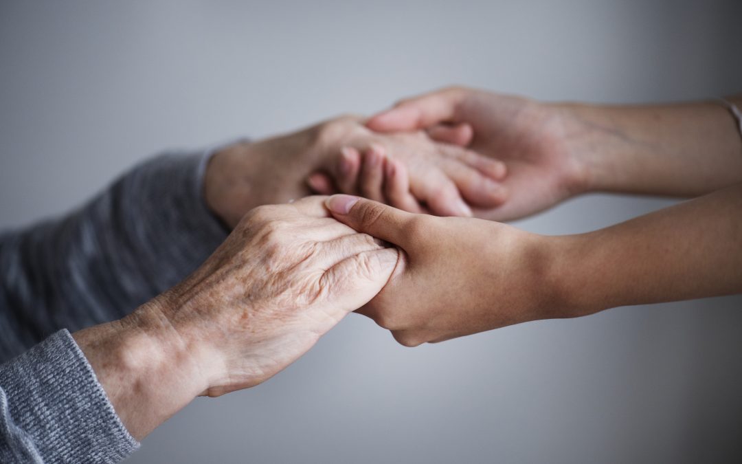Foto reichende Hände in Bezug auf Pflege